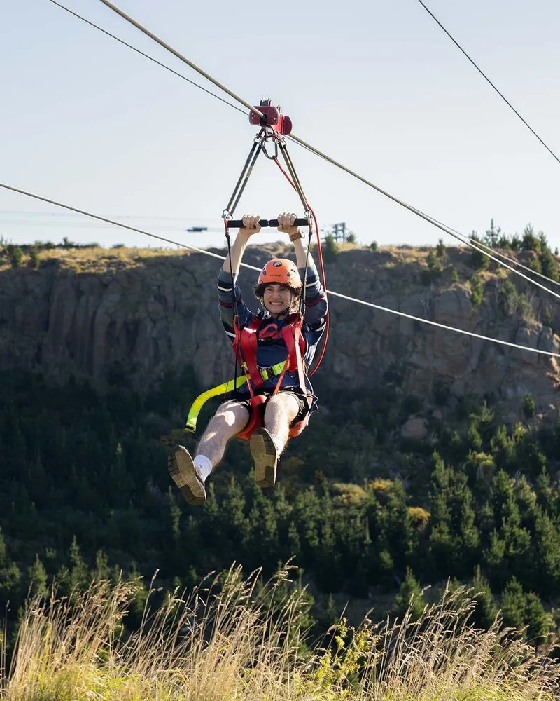Man enjoying the zipline at the Christchurch Adventure Park.